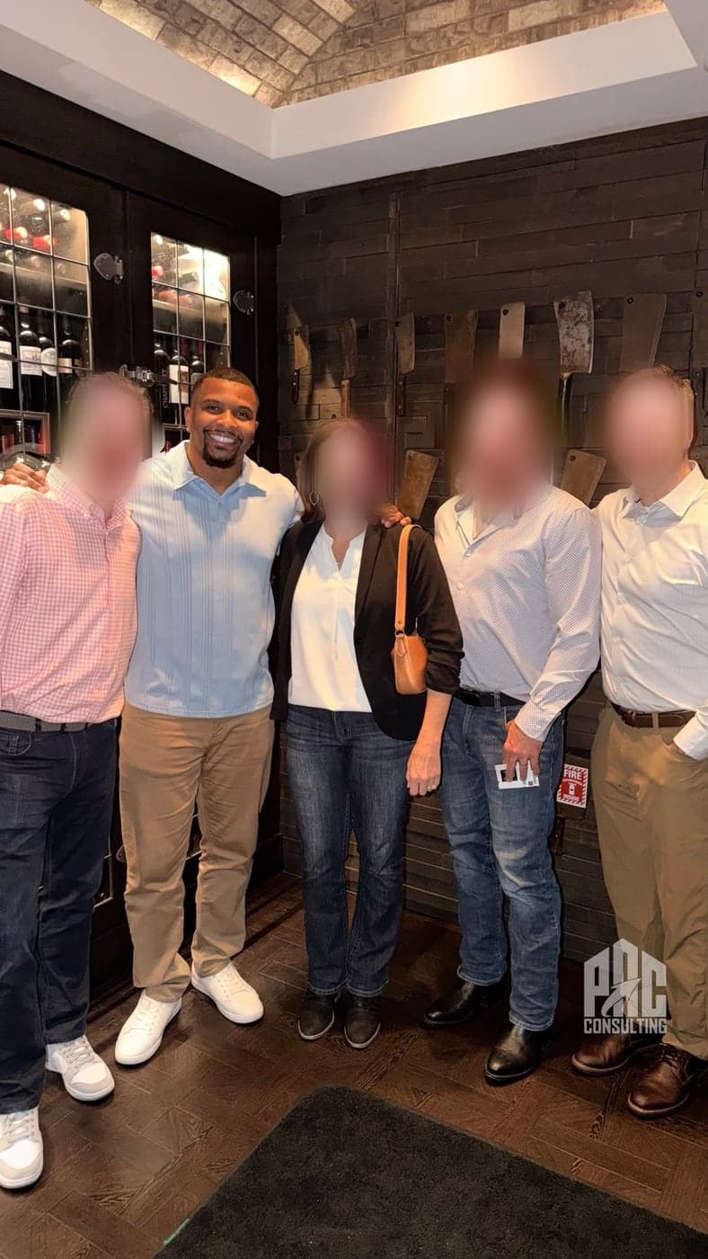 Phillip Crawford with a group of business owners he has worked with — their faces blurred for confidentiality