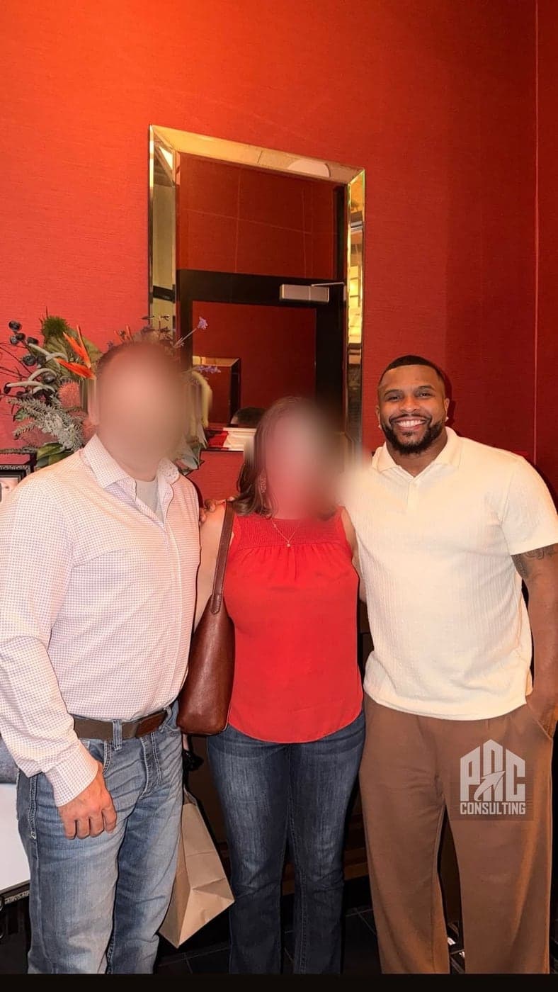 Phillip Crawford with a business-owner couple he has worked with — their faces blurred for confidentiality